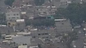 Pollution blankets the sky over the iconic Estadio Azteca and the rest of Mexico City, Thursday, May 16, 2019. A semifinal match between America and Leon that had already been postponed due to air quality will be played out of the city in Queretaro on Thursday. (AP Photo/Rebecca Blackwell)