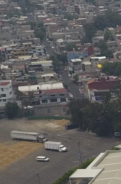 Pollution blankets the sky over the iconic Estadio Azteca and the rest of Mexico City, Thursday, May 16, 2019. A semifinal match between America and Leon that had already been postponed due to air quality will be played out of the city in Queretaro on Thursday. (AP Photo/Rebecca Blackwell)