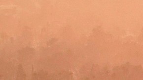 Smoke lingers over a neighborhood devastated by the Eaton Fire, Thursday, Jan. 9, 2025, in Altadena, Calif.