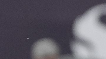 San Diego FC midfielder Hirving Lozano, left, misses a shot on goal as Vancouver Whitecaps defender Édier Ocampo looks on during the first half of an MLS soccer match Saturday, July 19, 2025, in San Diego. (AP Photo/Gregory Bull)