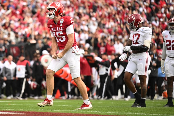Indiana quarterback Fernando Mendoza reacts after throwing a touchdown pass to Charlie Becker in the first half of the game against Alabama.