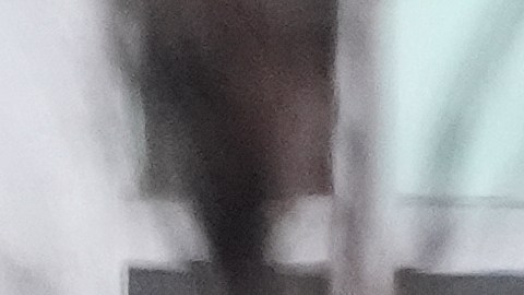 Federal agents stand outside a warehouse as federal officials tour the facility to consider repurposing it as an ICE detention facility, Thursday, Jan. 15, 2026, in Kansas City, Mo. (AP Photo/Charlie Riedel)