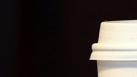 Featured coffee drinks sizes, Dumb Venti, Dumb Grande, and Dumb Tall are displayed inside the Dumb Starbucks coffee shop in Los Angeles Monday, Feb. 10, 2014. A mysterious shop named "Dumb Starbucks" is serving coffee in Los Angeles after drawing weekend crowds that waited in a line two blocks long. The store resembles a Starbucks with a green awning and mermaid logo, but with the word "Dumb" attached above the Starbucks sign. (AP Photo/Damian Dovarganes)