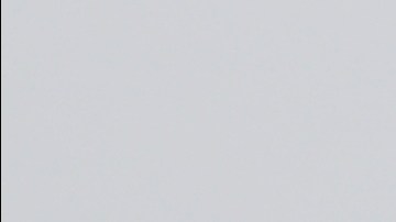 FILE - Barbed wire fencing is shown behind a sign in English and Spanish in a recreation yard used by detainees during a media tour of the U.S. Immigration and Customs Enforcement detention center, Dec. 16, 2019, in Tacoma, Wash. (AP Photo/Ted S. Warren, file)