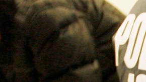 Suspects are interviewed by an Immigration and Customs Enforcement (ICE) officers after a raid in Santa Ana, Calif., Wednesday, Jan. 17, 2007. The week-long series of raids targeting five counties in the greater Los Angeles metropolitan area resulted in the arrest of 338 illegal immigrants at their homes, while another 423 were taken into ICE custody at county jails, said Virginia Kice, spokeswoman for U.S. Immigration and Customs Enforcement. (AP Photo/Mark Avery)