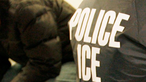 Suspects are interviewed by an Immigration and Customs Enforcement (ICE) officers after a raid in Santa Ana, Calif., Wednesday, Jan. 17, 2007. The week-long series of raids targeting five counties in the greater Los Angeles metropolitan area resulted in the arrest of 338 illegal immigrants at their homes, while another 423 were taken into ICE custody at county jails, said Virginia Kice, spokeswoman for U.S. Immigration and Customs Enforcement. (AP Photo/Mark Avery)