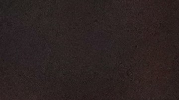 A protester raises their arms on the ground as law enforcement make arrests after declaring an unlawful assembly during a noise demonstration outside the Graduate by Hilton Minneapolis hotel on Wednesday, Jan. 28, 2026, in Minneapolis. (AP Photo/Adam Gray)