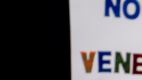 Protesters rally in front of the Ohio Statehouse in Columbus, Ohio, on Sunday, Jan. 4, 2026, after the U.S. captured Venezuelan President Nicolás Maduro and his wife in a military operation. (AP Photo/Jessica Phelps)