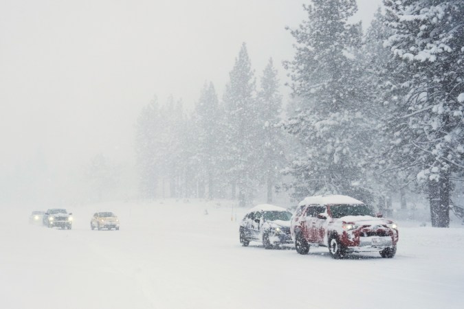 Motorists drive on a snow-covered road during a storm on Tuesday, Feb. 17, 2026 in Truckee Calif. (AP Photos/Brooke Hess-Homeier)
