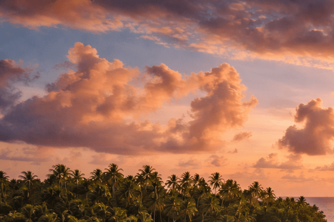Crucero anclado frente a una isla tropical al atardecer.