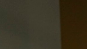 FILE - A protester, demonstrating against COVID-19 vaccine mandates, holds a sign outside the front windows of the Los Angeles Unified School District, LAUSD headquarters in Los Angeles, Sept. 9, 2021. The Los Angeles public school system became the latest in California to delay a deadline for mandatory student COVID-19 vaccinations. The board of the Los Angeles Unified School District voted Tuesday night, Dec. 14 to postpone a Jan. 10 deadline until fall 2022 for all students 12 and older to be vaccinated. (AP Photo/Damian Dovarganes, File)