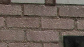 FILE - In this March 20, 2020 file photo a man covers his face with a mask as he walks past tents on skid row, in Los Angeles. A fed-up federal judge says last week's rainstorm created "extraordinarily harsh" conditions for homeless residents of Los Angeles and he has ordered city officials to meet with him this week at a Skid Row shelter to discuss how to address the worsening crisis of people living on the streets. (AP Photo/Marcio Jose Sanchez,File)