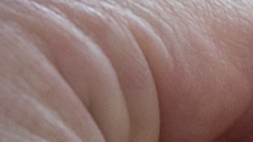 California Highway Patrol Sgt. Scott Siria, right, places a black band on the badge of CHP Lieutenant Ben Moser before the start of the funeral service for Sacramento County Deputy Sheriff Robert French, Thursday, Sept. 7, 2017, in Roseville, Calif. French was shot and killed in a shoot out with an suspect during an auto theft investigation in Sacramento, Calif., last Wednesday. (AP Photo/Rich Pedroncelli)