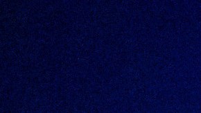 A police car drives through an intersection during a protest in downtown Los Angeles on Friday, Jan. 30, 2026. (AP Photo/Ethan Swope)