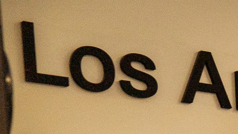 Visitors wait in line to be screened by security before being allowed to enter the Los Angeles Unified School District administrative offices in Los Angeles Thursday Sept. 9, 2021. The Los Angeles board of education is expected to vote Thursday, on whether to require all students 12 and older to be fully vaccinated against the coronavirus to participate in on-campus instruction in the nation's second-largest school district. (AP Photo/Damian Dovarganes)