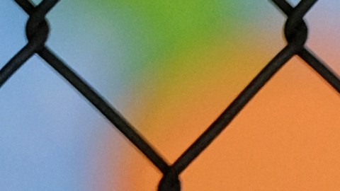 A chain-link fence lock is seen on a gate at a closed Ranchito Elementary School in the San Fernando Valley section of Los Angeles on Monday, July 13, 2020. Amid spiking coronavirus cases, Los Angeles Unified School District campuses will remain closed when classes resume in August, Superintendent Austin Beutner said Monday. (AP Photo/Richard Vogel)