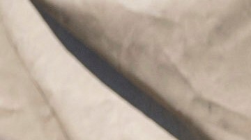 Federal immigration agents talk to Rebecca Torres after she tried to block a military vehicle during a raid in the agriculture area of Camarillo, Calif., Thursday, July 10, 2025. (AP Photo/Michael Owen Baker)