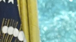 President Donald Trump speaks holding a large ticket representing a ticket for the World Cup final, row one, seat one, as Andrew Giuliani, from left, Richard Grenell, president of the Kennedy Center Board of Trustees, Vice President JD Vance, FIFA President Gianni Infantino and Homeland Security Secretary Kristi Noem listen in the Oval Office of the White House, Friday, Aug. 22, 2025, in Washington. (AP Photo/Jacquelyn Martin)