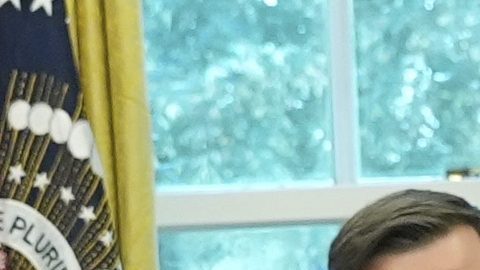 President Donald Trump speaks holding a large ticket representing a ticket for the World Cup final, row one, seat one, as Andrew Giuliani, from left, Richard Grenell, president of the Kennedy Center Board of Trustees, Vice President JD Vance, FIFA President Gianni Infantino and Homeland Security Secretary Kristi Noem listen in the Oval Office of the White House, Friday, Aug. 22, 2025, in Washington. (AP Photo/Jacquelyn Martin)