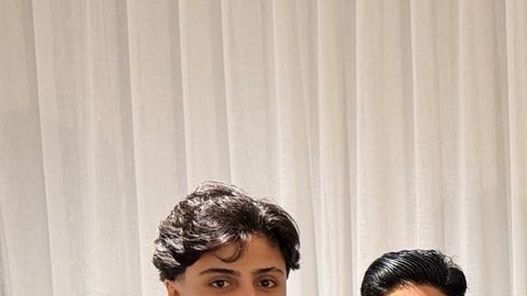 In this photo supplied by Australia's Minister for Home Affairs Tony Burke's office, the Minister Tony Burke, center, poses in an undisclosed location with five Iranian women soccer players who have been granted asylum in Australia, Tuesday, March 10, 2026. (Australia Ministry of Home Affairs via AP)