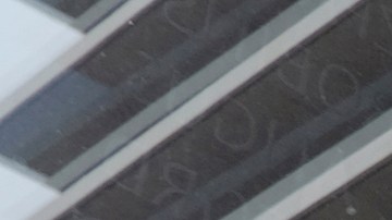 FILE - A person stands near the front of the headquarters of the Los Angeles Department of Water and Power in downtown Los Angeles on Wednesday, March 18, 2015. Los Angeles will pay $38 million to settle a lawsuit over the death of two people who were electrocuted after touching a power line that fell into their backyard. The Department of Water and Power has agreed to settle a suit over the January 2021 deaths of Ferdinand Tejada of Panorama City and his 20-year-old daughter, Janina Tejada. (AP Photo/Richard Vogel, File)