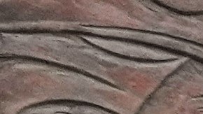 Motorbikes drive past a billboard depicting Iran’s late Supreme Leader Ayatollah Ali Khamenei, center, handing the country’s flag to his son and successor Ayatollah Mojtaba Khamenei, right, as the late revolutionary founder Ayatollah Ruhollah Khomeini stands at left, in a square in downtown Tehran, Iran, Tuesday, March 10, 2026. (AP Photo/Vahid Salemi)