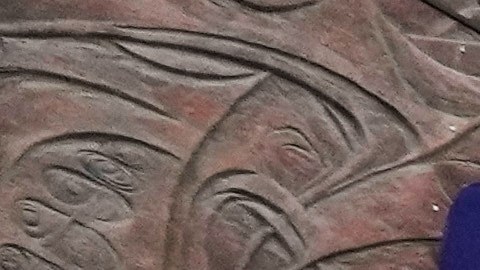 Motorbikes drive past a billboard depicting Iran’s late Supreme Leader Ayatollah Ali Khamenei, center, handing the country’s flag to his son and successor Ayatollah Mojtaba Khamenei, right, as the late revolutionary founder Ayatollah Ruhollah Khomeini stands at left, in a square in downtown Tehran, Iran, Tuesday, March 10, 2026. (AP Photo/Vahid Salemi)