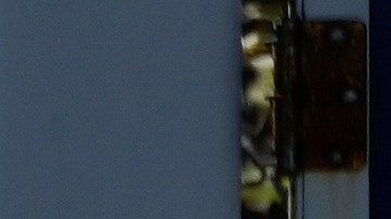 A car drives behind the gasoline price board of a gas station in San Francisco, Thursday, March 5, 2026. (AP Photo/Jeff Chiu)