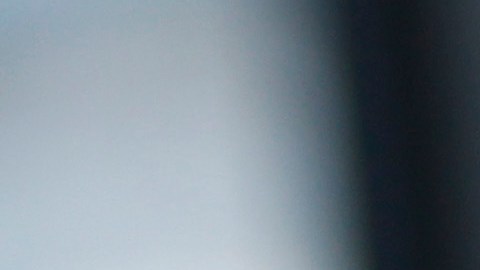 A handcuffed suspect waits inside a police bus during an operation against alleged drug traffickers at the Complexo do Alemao slum in Rio de Janeiro, Brazil, Saturday, Nov. 27, 2010. Soldiers and police crouching behind armored vehicles trained their rifles on dozens of entrances to a sprawling slum Saturday, preparing to invade and try to push drug gangs out an area long considered the most dangerous in Rio de Janeiro, a city set to host the 2016 Olympics. (AP Photo/Felipe Dana)