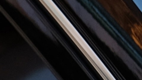 FILE - In this Tuesday, Jan. 12, 2016 file photo, a driver displaying Lyft and Uber stickers on his front windshield drops off a passenger in downtown Los Angeles, Calif. Passengers arriving at Los Angeles International Airport will be allowed to leave in an UberX car starting Thursday, Jan. 21. (AP Photo/Richard Vogel, File)