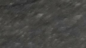 man holds a picture of U.S. President Donald Trump upside down after Friday prayers at the Imam Khomeini Grand Mosque in Tehran, Iran, Friday, March 20, 2026. (AP Photo/Vahid Salemi)