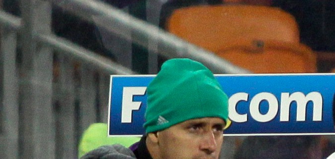Mexican players shelter from the cold as they sit on the bench during the World Cup round of 16 soccer match between Argentina and Mexico at Soccer City in Johannesburg, South Africa, Sunday, June 27, 2010. Argentina won 3-1. (AP Photo/Ivan Sekretarev)