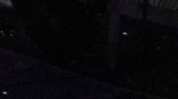 FILE - Wrestling fans, under a Wrestlemania sign, watch a WWE Monday Night RAW event, March 6, 2023, in Boston. This year's WrestleMania may be just days away, but the marketing run up to WWE's biggest premium live event went into overdrive months ago. (AP Photo/Charles Krupa, File)