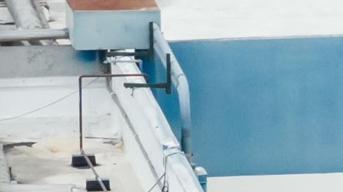 Water is sprayed on a damaged tank at GKN Aerospace in Garden Grove, Calif., on Sunday, May 24, 2026, after the tank containing a chemical used to make plastic parts overheated Thursday. (AP Photo/Ethan Swope)