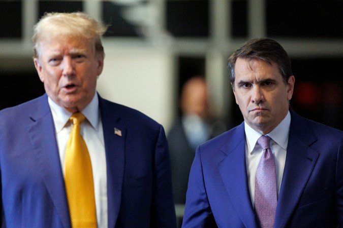Former President Donald Trump, with his lawyer Todd Blanche, right, speaks to members of the media as he arrives at Manhattan criminal court, Tuesday, May 7, 2024, in New York. . (Sarah Yenesel/Pool Photo via AP)