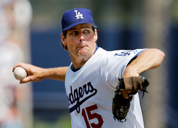 FILE - In this April 3, 2005, file photo, Los Angeles Dodgers pitcher Scott Erickson throws to a Los Angeles Angels batter in a baseball game in Los Angeles. Former Dodger Erickson has been charged with reckless driving in connection with a hit-and-run in Southern California that killed two boys last year. The Los Angeles District Attorney's office said Erickson, 52, was charged Wednesday, Jan. 27, 2021, with one misdemeanor count of reckless driving. Investigators told KABC-TV he was racing with Rebecca Grossman on Sept. 29, moments before she struck and killed the two boys as they crossed a street in Westlake Village. (AP Photo/Mark J. Terrill, File)