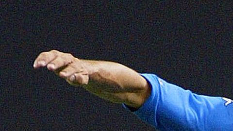 Italian team captain Paolo Maldini, left, holds of the challenge of Ecuador's captain Alex Aguinaga during the 2002 World Cup Group G soccer match between Italy and Ecuador at the Sapporo Dome, Japan, Monday June 3, 2002. The other teams in Group G are Mexico and Croatia. (AP Photo/Ed Wray)