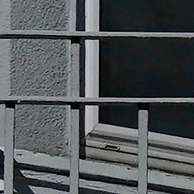 A motorcyclist rides in front of a For Rent sign in a window of a residential property in San Francisco, Tuesday, Oct. 20, 2020. (AP Photo/Jeff Chiu)