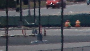In this Friday, May 13, 2016, photo, as a commercial airliner taxis for takeoff, the perimeter fencing and razor wires show the layers of security at San Diego International Airport. An Associated Press investigation has documented perimeter breaches at many of the busiest airports in the U.S. (AP Photo/Lenny Ignelzi)