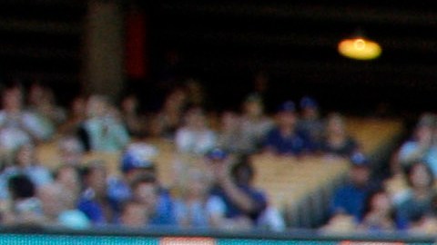 Former Los Angeles Dodgers pitcher Tommy John, left, chats with Dr. Kerlan Jobe, who invented the surgery known as ulnar collateral ligament (UCL) reconstruction, now better known as Tommy John surgery, as both are honored before a game against the San Diego Padres at Dodger Stadium Saturday, July 14, 2012. In the procedure, which saved the career of John after he underwent it in 1974, a ligament in the medial elbow is replaced with a tendon from elsewhere in the body. (AP Photo/Reed Saxon)